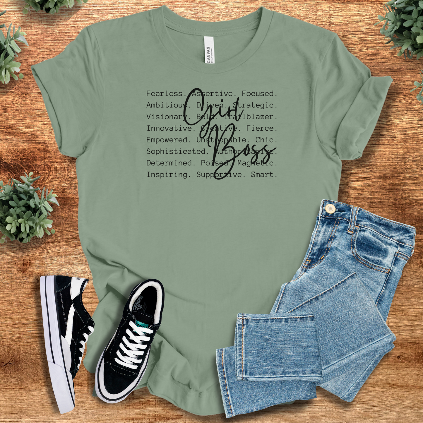 Heather-mauve t-shirt with '' text, flat lay styled on a wooden surface.