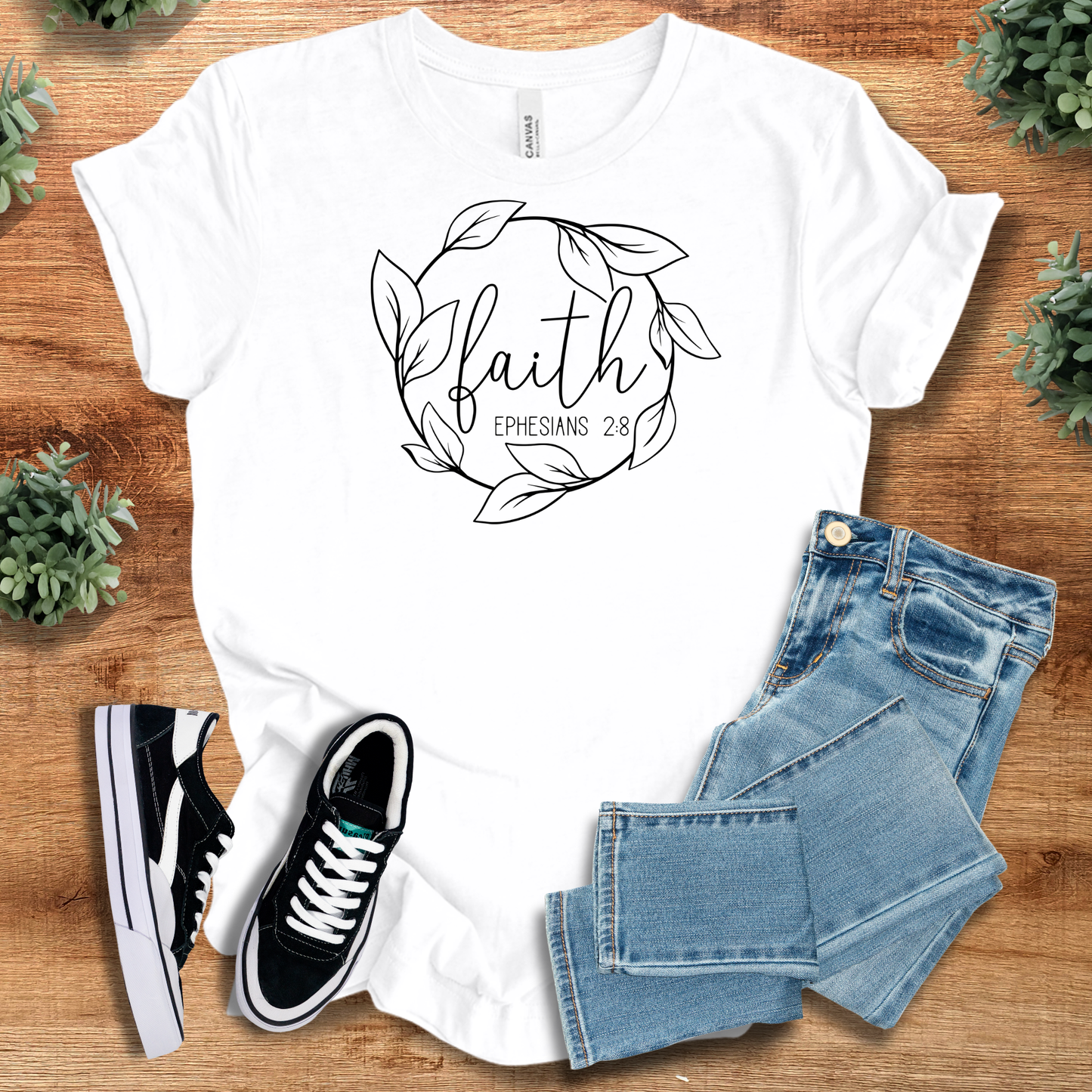 White Faith Ephesians 2:8 T-Shirt featuring a minimalist leaf wreath and scripture verse. Soft cotton tee ideal for Christian-themed outfits.