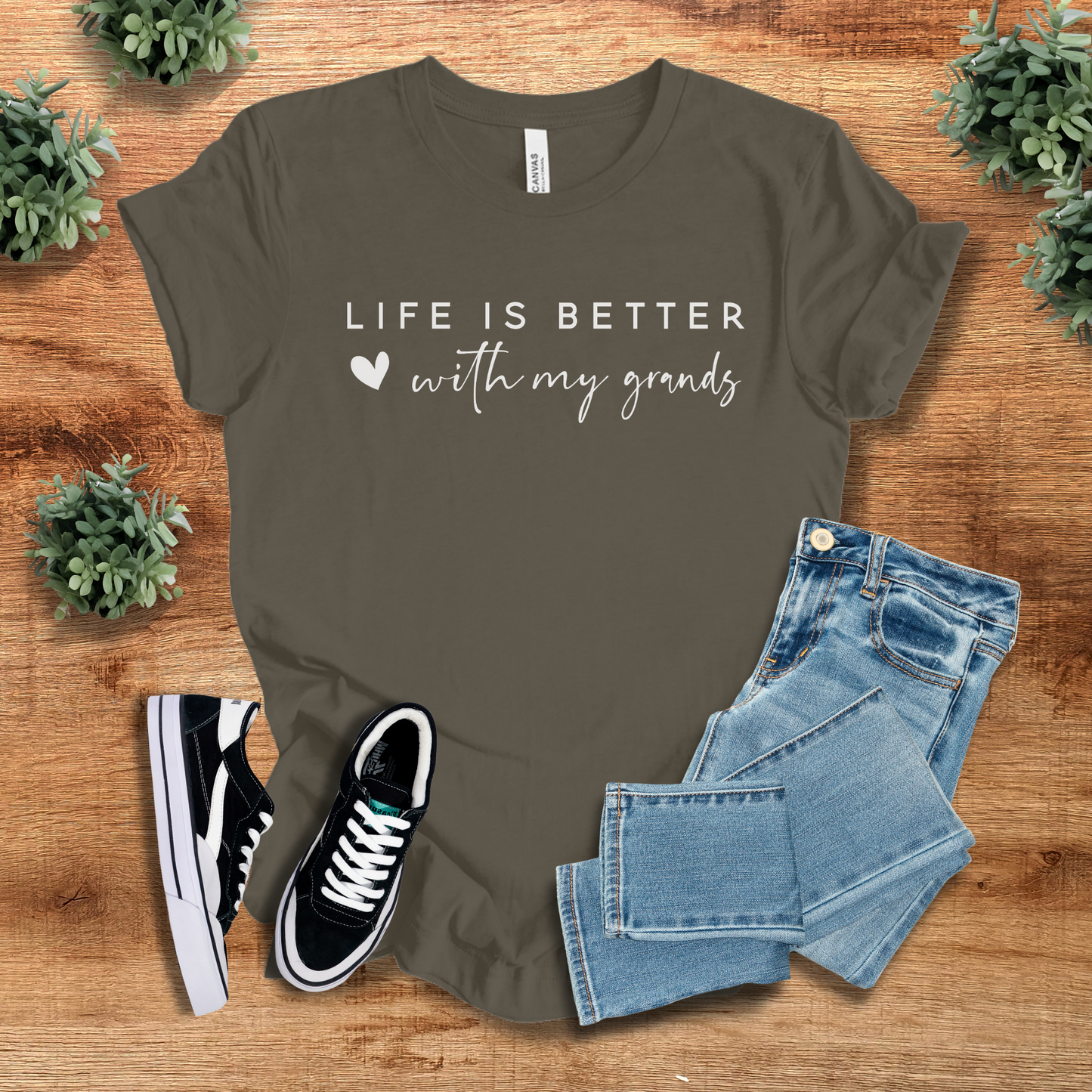 Athletic-heather t-shirt with '' text, flat lay styled on a wooden surface.