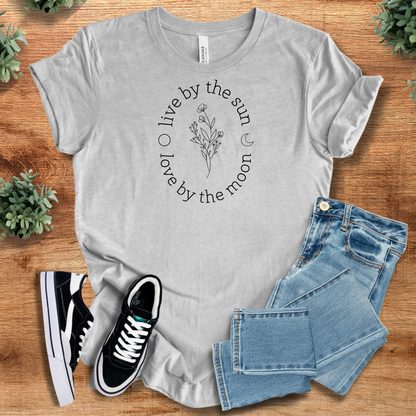 Soft-cream t-shirt with '' text, flat lay styled on a wooden surface.