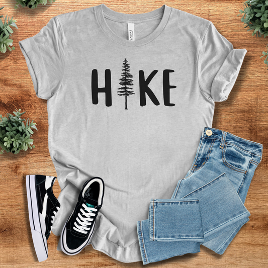 Hike T‑Shirt in heather gray on soft Bella+Canvas 3001 tee with minimalist tree graphic. Unisex comfy everyday nature-inspired t-shirt.