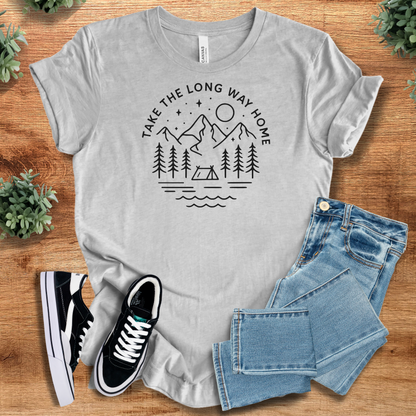 Heather-aqua t-shirt with '' text, flat lay styled on a wooden surface.