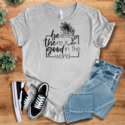 Soft-cream t-shirt with '' text, flat lay styled on a wooden surface.