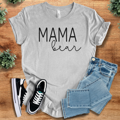 Heather-navy t-shirt with '' text, flat lay styled on a wooden surface.