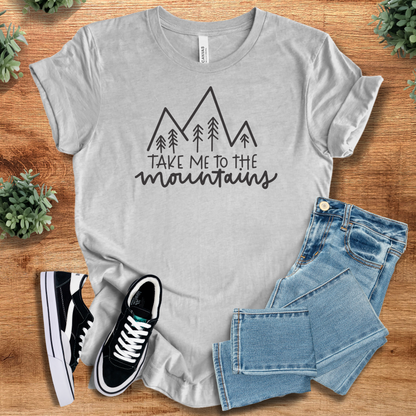 Soft-cream t-shirt with '' text, flat lay styled on a wooden surface.