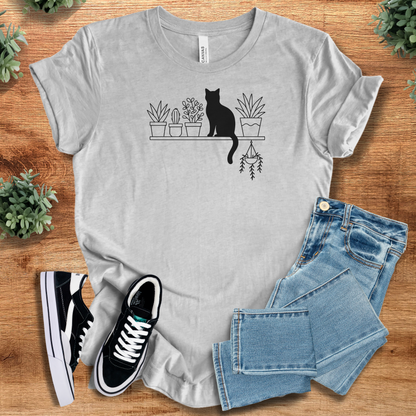 Heather-mauve t-shirt with '' text, flat lay styled on a wooden surface.