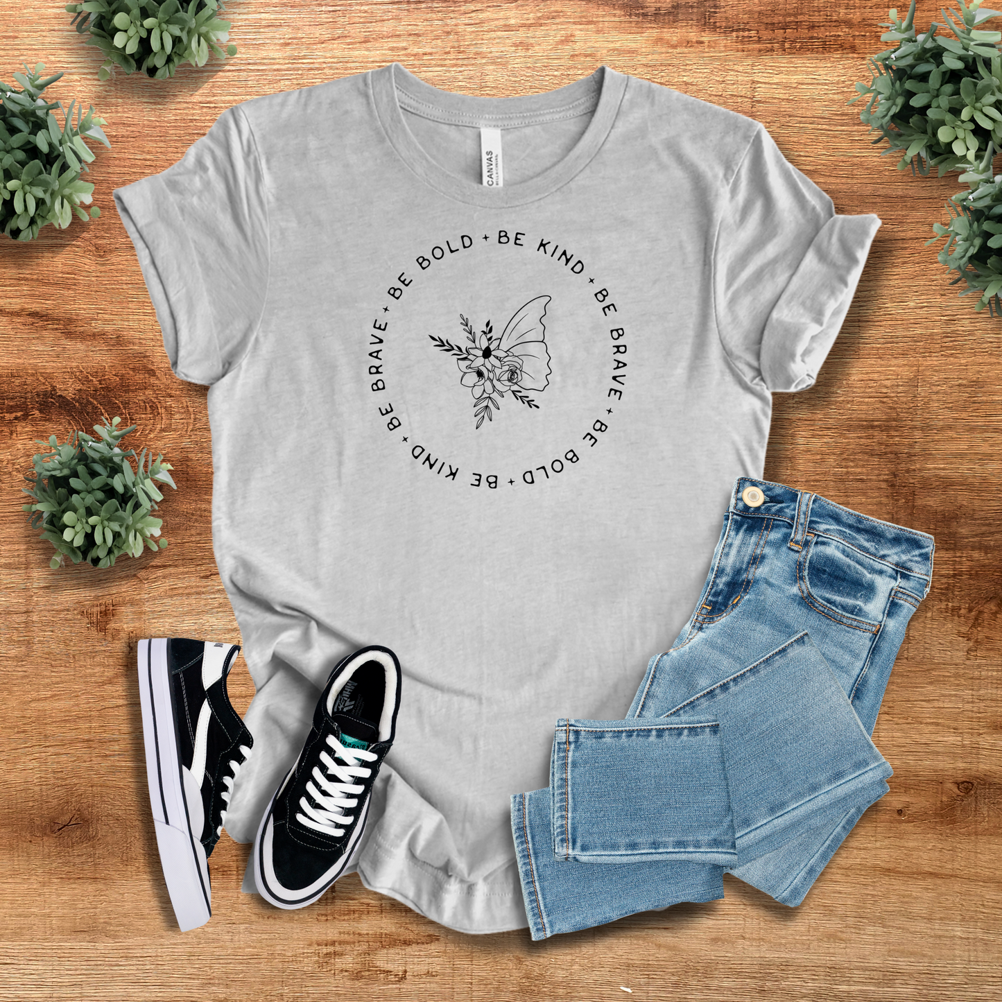 Heather gray Be Bold Be Kind T-Shirt featuring a nature-inspired butterfly design and uplifting message. Soft cotton blend for all-day comfort.