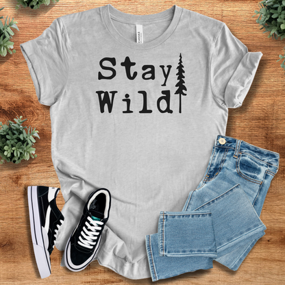 Heather-navy t-shirt with '' text, flat lay styled on a wooden surface.