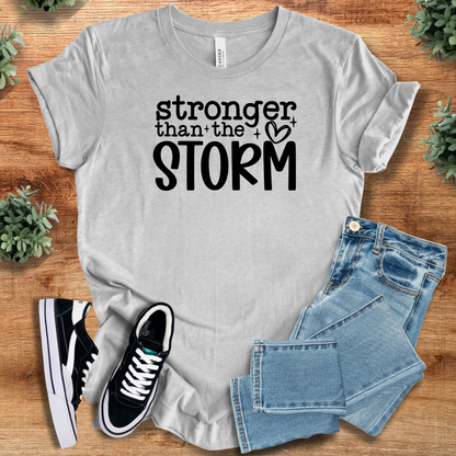 Heather-aqua t-shirt with '' text, flat lay styled on a wooden surface.