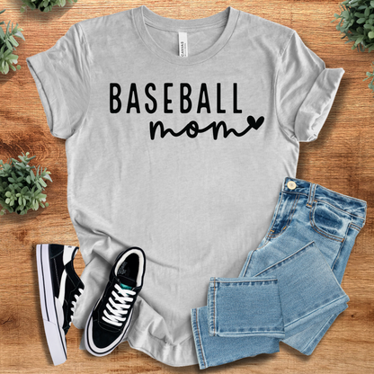 Heather-navy t-shirt with '' text, flat lay styled on a wooden surface.