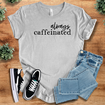 Heather-mauve t-shirt with '' text, flat lay styled on a wooden surface.