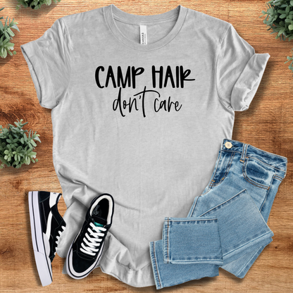 Heather-aqua t-shirt with '' text, flat lay styled on a wooden surface.