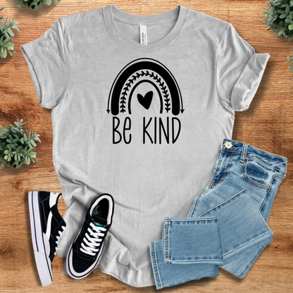 Heather-mauve t-shirt with '' text, flat lay styled on a wooden surface.
