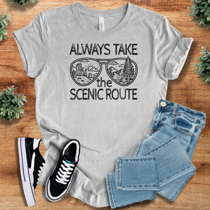 Heather-mauve t-shirt with '' text, flat lay styled on a wooden surface.