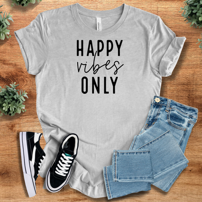 Heather-mauve t-shirt with '' text, flat lay styled on a wooden surface.
