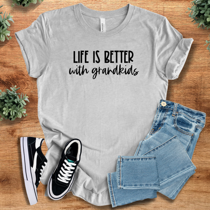 Heather-navy t-shirt with '' text, flat lay styled on a wooden surface.