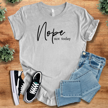 Heather-aqua t-shirt with '' text, flat lay styled on a wooden surface.