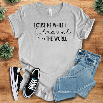 Heather-aqua t-shirt with '' text, flat lay styled on a wooden surface.