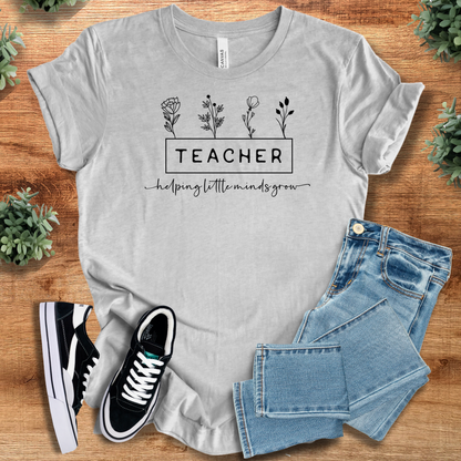 Soft-cream t-shirt with '' text, flat lay styled on a wooden surface.