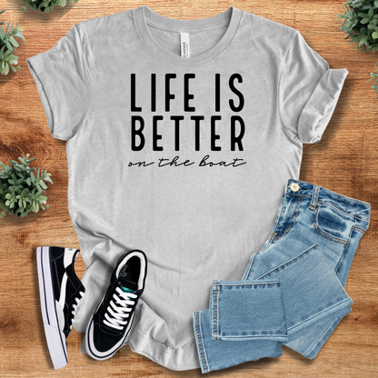 Heather-navy t-shirt with '' text, flat lay styled on a wooden surface.