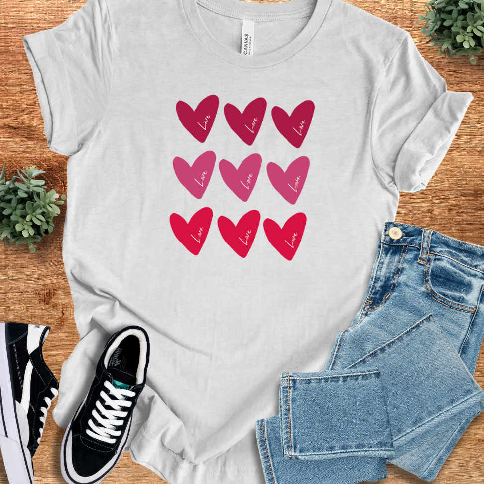 Valentine Hearts T‑Shirt on soft Bella+Canvas 3001 in heather gray with red and pink heart graphics, perfect comfy unisex tee for Valentine's Day.
