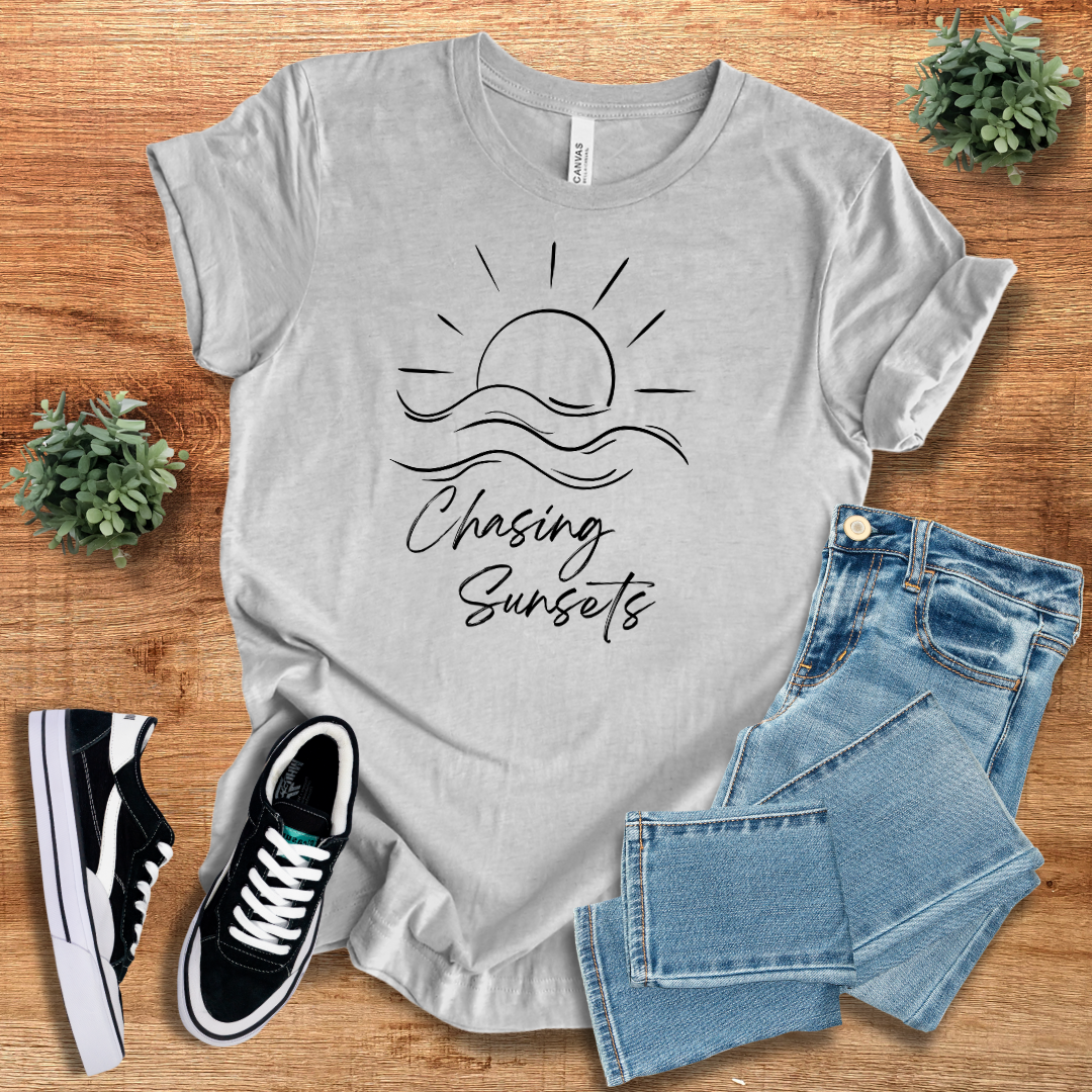 Gray Chasing Sunsets T-shirt with a sleek black sun and waves design, offering a comfortable and breathable fit. Ideal for casual everyday wear.