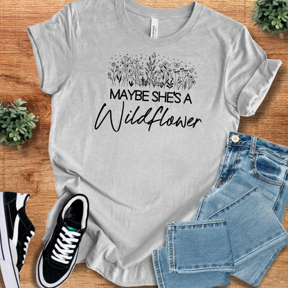 Heather-aqua t-shirt with '' text, flat lay styled on a wooden surface.
