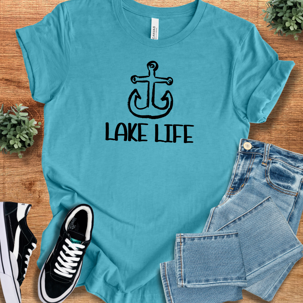 Turquoise Lake Life Graphic Tee featuring a black anchor design, perfect for summer adventures and casual outdoor wear.