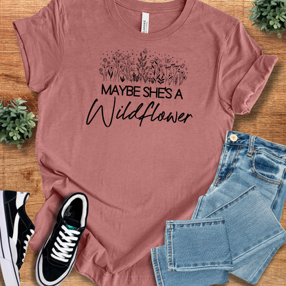 Heather-aqua t-shirt with '' text, flat lay styled on a wooden surface.
