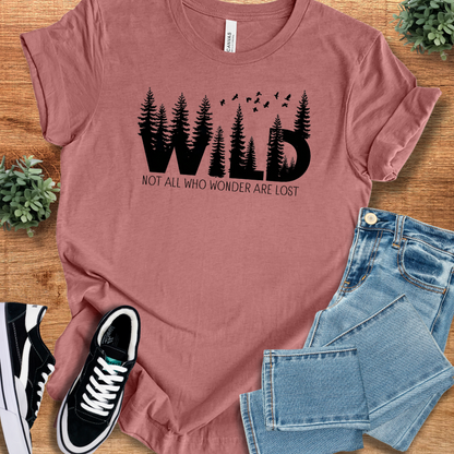 Soft-cream t-shirt with '' text, flat lay styled on a wooden surface.