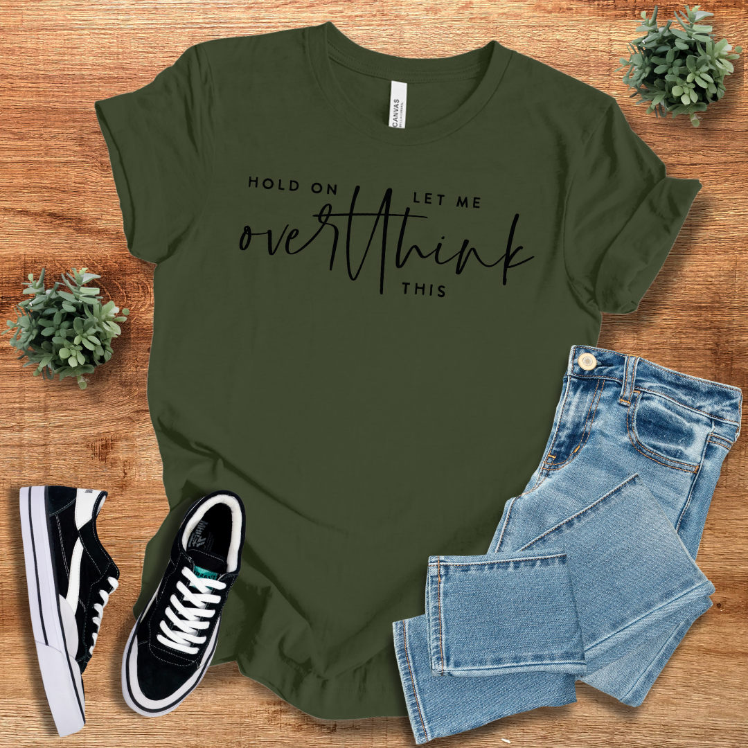 Olive green 'Hold On Let Me Overthink This' t-shirt featuring black script text. Comfortable cotton fabric with a stylish, casual fit.