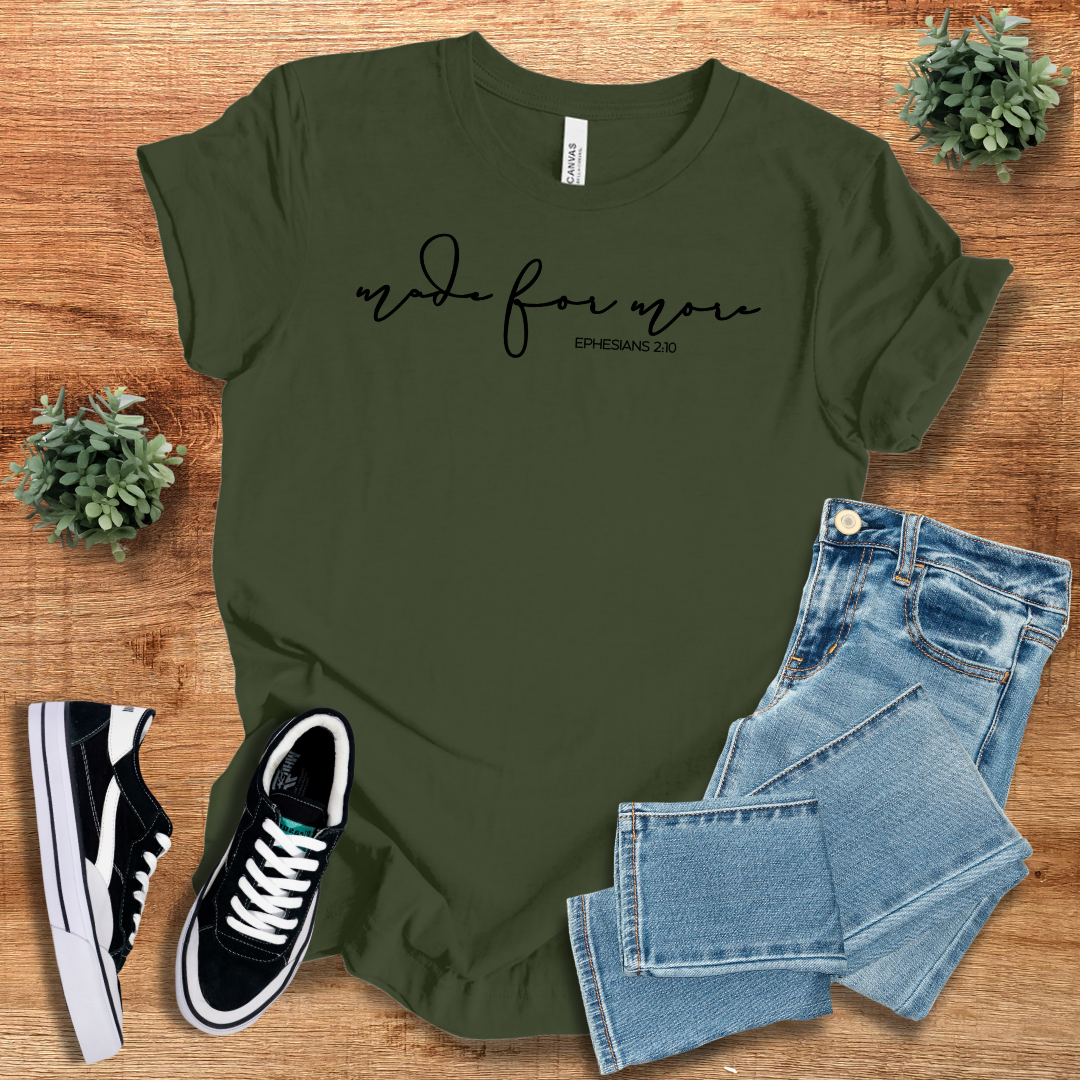 Dark green Made for More Graphic Tshirt with black script text, styled with jeans and sneakers. A versatile and sustainable casual wear option.