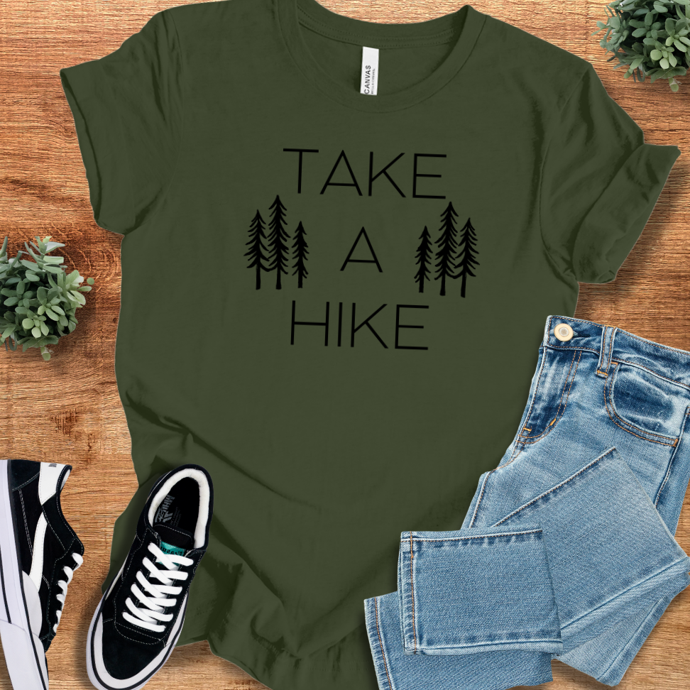 Heather-mauve t-shirt with '' text, flat lay styled on a wooden surface.