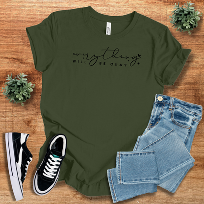 Olive green 'Everything Will Be Ok' t-shirt with black script text, paired with denim jeans and sneakers. A stylish and relaxed fit casual tee.