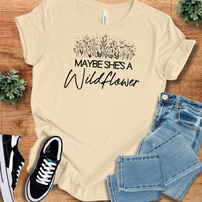 Heather-aqua t-shirt with '' text, flat lay styled on a wooden surface.