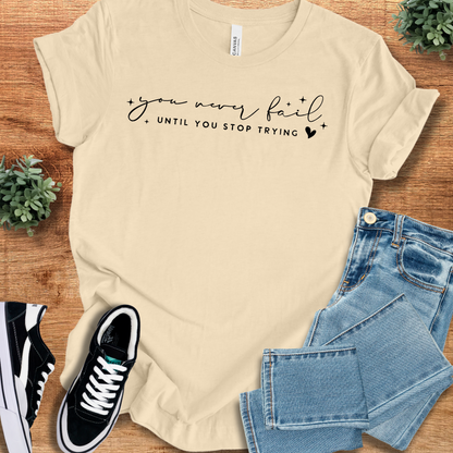 Heather-aqua t-shirt with '' text, flat lay styled on a wooden surface.