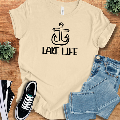 Heather-aqua t-shirt with '' text, flat lay styled on a wooden surface.