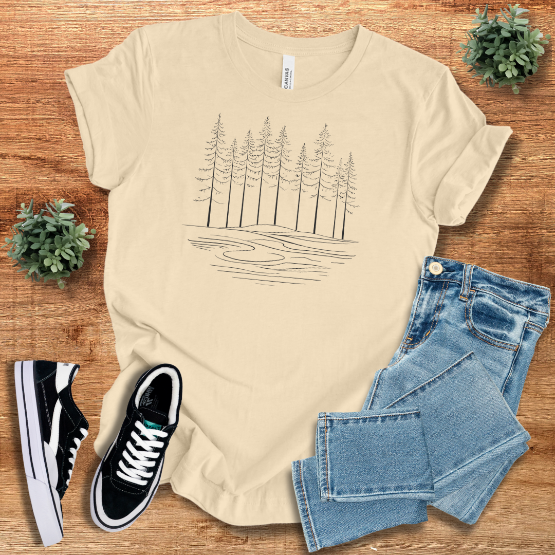 Beige Peaceful Woods T-shirt with a minimalist tree and river design, offering a relaxed fit and breathable fabric for daily wear.