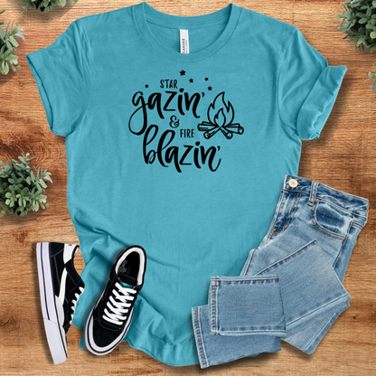 Heather-navy t-shirt with '' text, flat lay styled on a wooden surface.