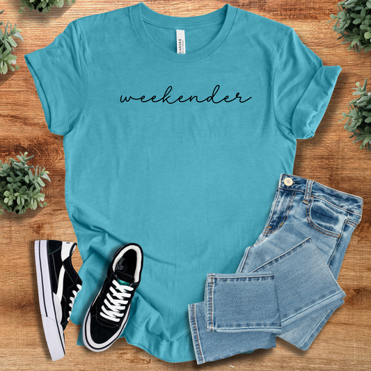Heather-aqua t-shirt with 'Weekender Tee' text, flat lay styled on a wooden surface.
