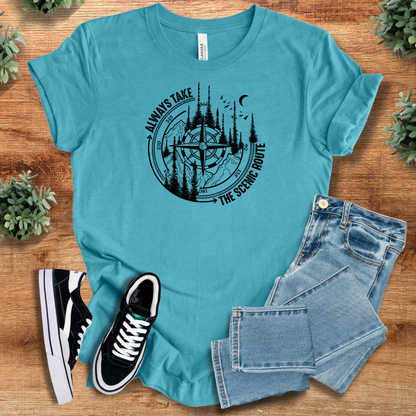 Heather-mauve t-shirt with '' text, flat lay styled on a wooden surface.