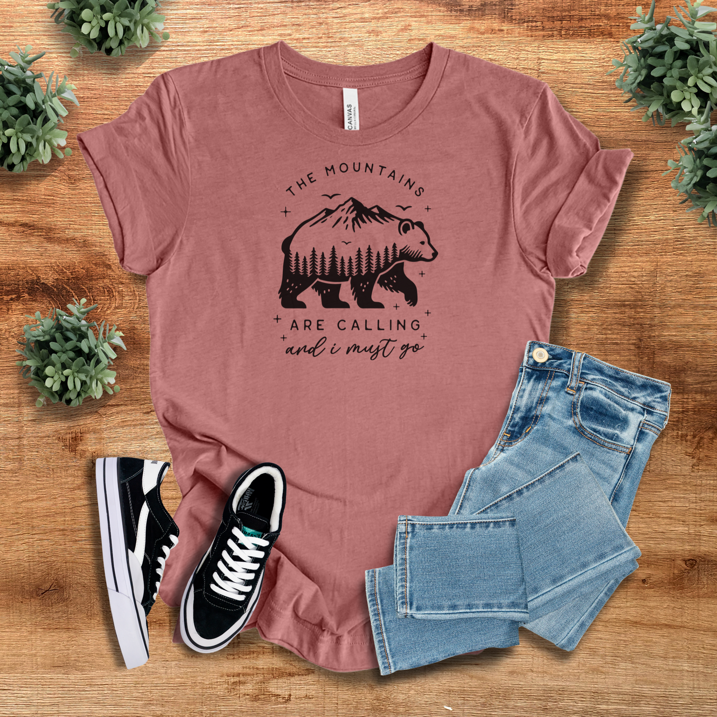 Soft cotton hiking t-shirt in dusty rose with a scenic bear and mountain print. A trendy outdoor shirt for national park lovers and adventure seekers.