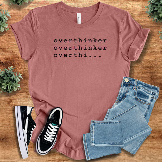 Overthinker T-shirt in mauve with quirky repeated text design. Unisex fit cotton tee ideal for casual wear or gifting introverts.