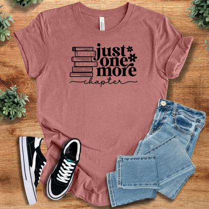 Heather-aqua t-shirt with '' text, flat lay styled on a wooden surface.