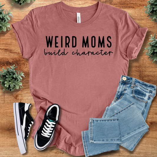 Weird Moms Build Character T-Shirt in mauve pink with bold black text. 100% cotton tee ideal for quirky moms and Mother's Day gifts.