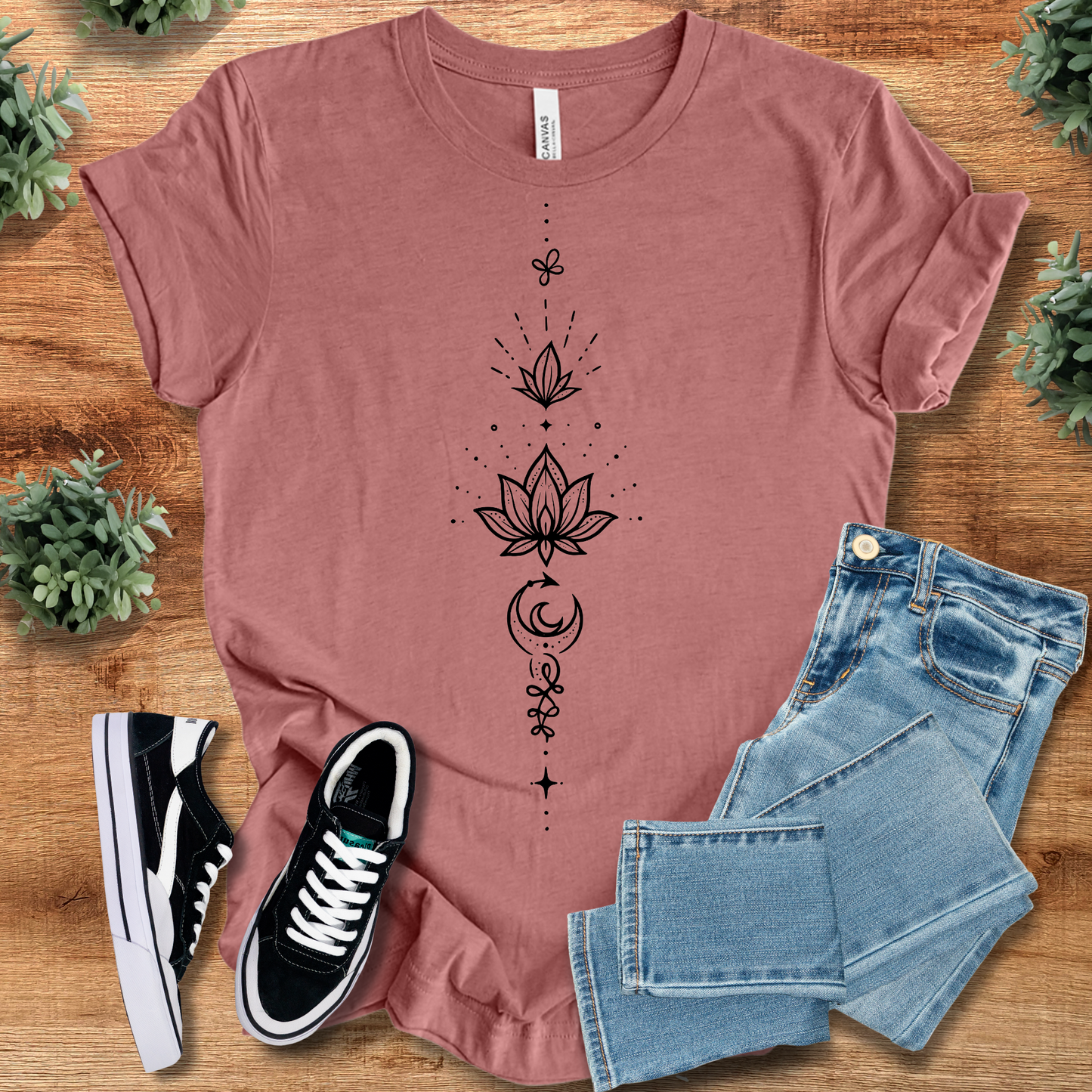 Athletic-heather t-shirt with '' text, flat lay styled on a wooden surface.