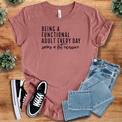 Heather-navy t-shirt with '' text, flat lay styled on a wooden surface.