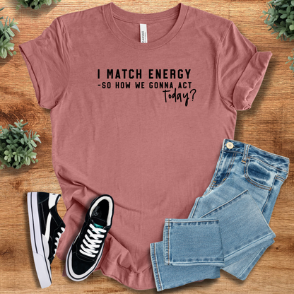 Heather-navy t-shirt with '' text, flat lay styled on a wooden surface.