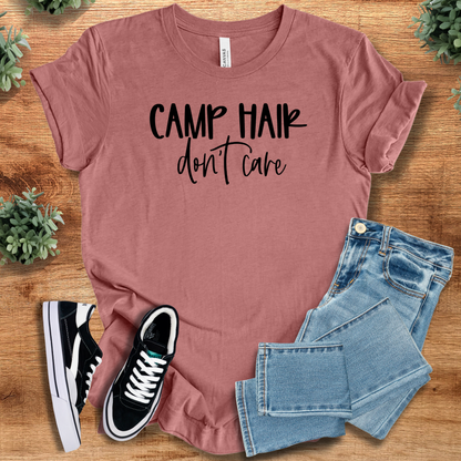 Heather-aqua t-shirt with '' text, flat lay styled on a wooden surface.