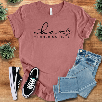Yellow t-shirt with '' text, flat lay styled on a wooden surface.